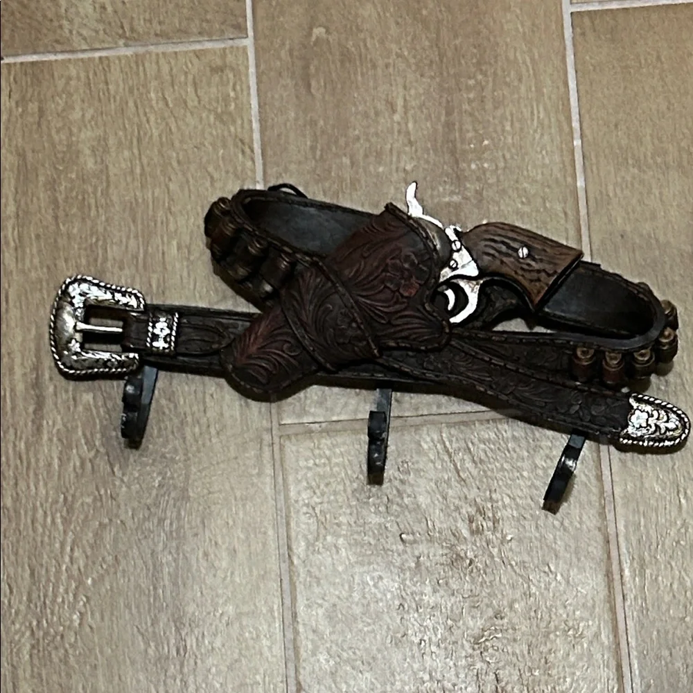 Gun belt wall hanger